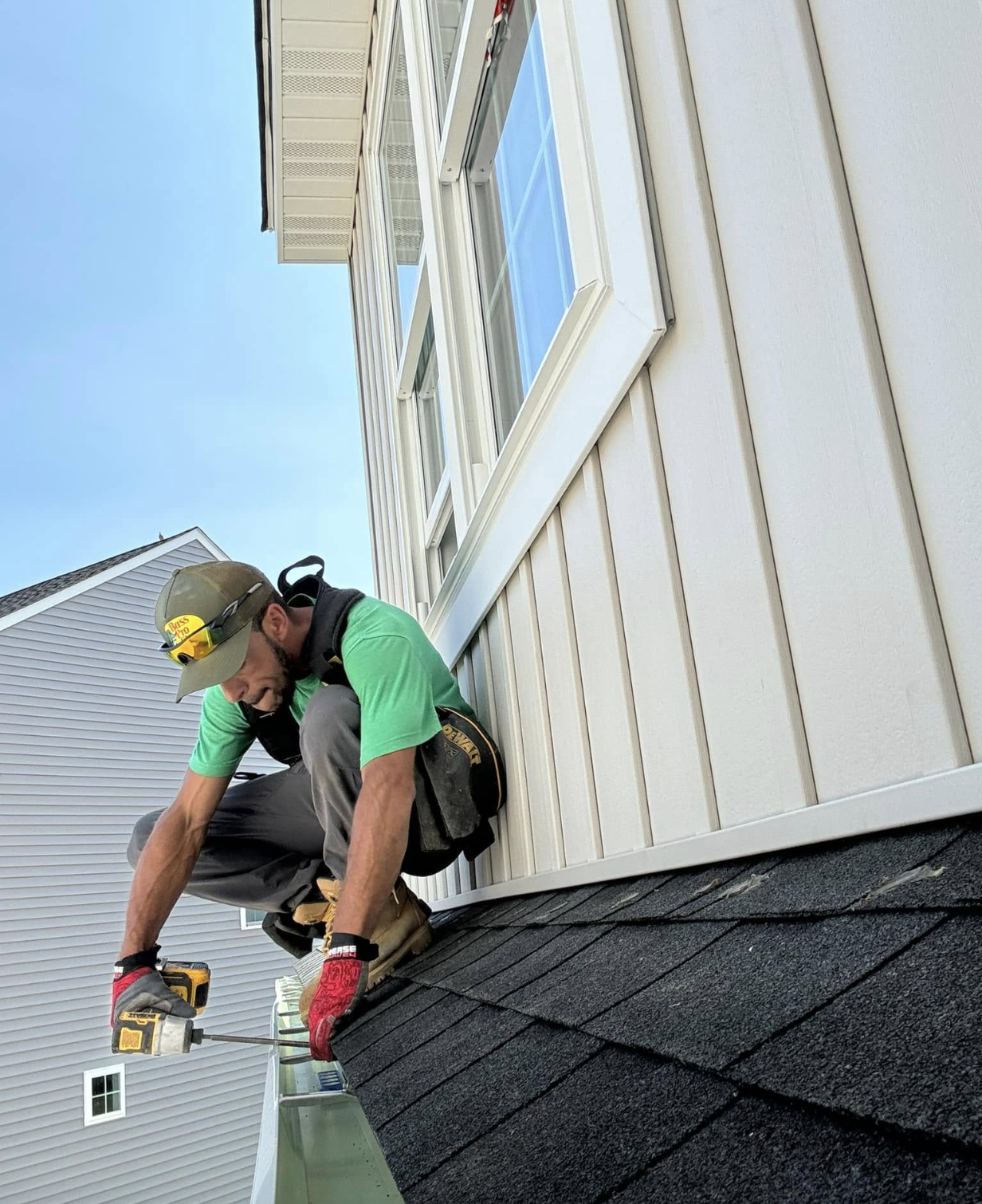 B. Good Spouting professional installing gutters on Lancaster County home